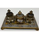 A 19th century gilt brass and silver section ink well stand.