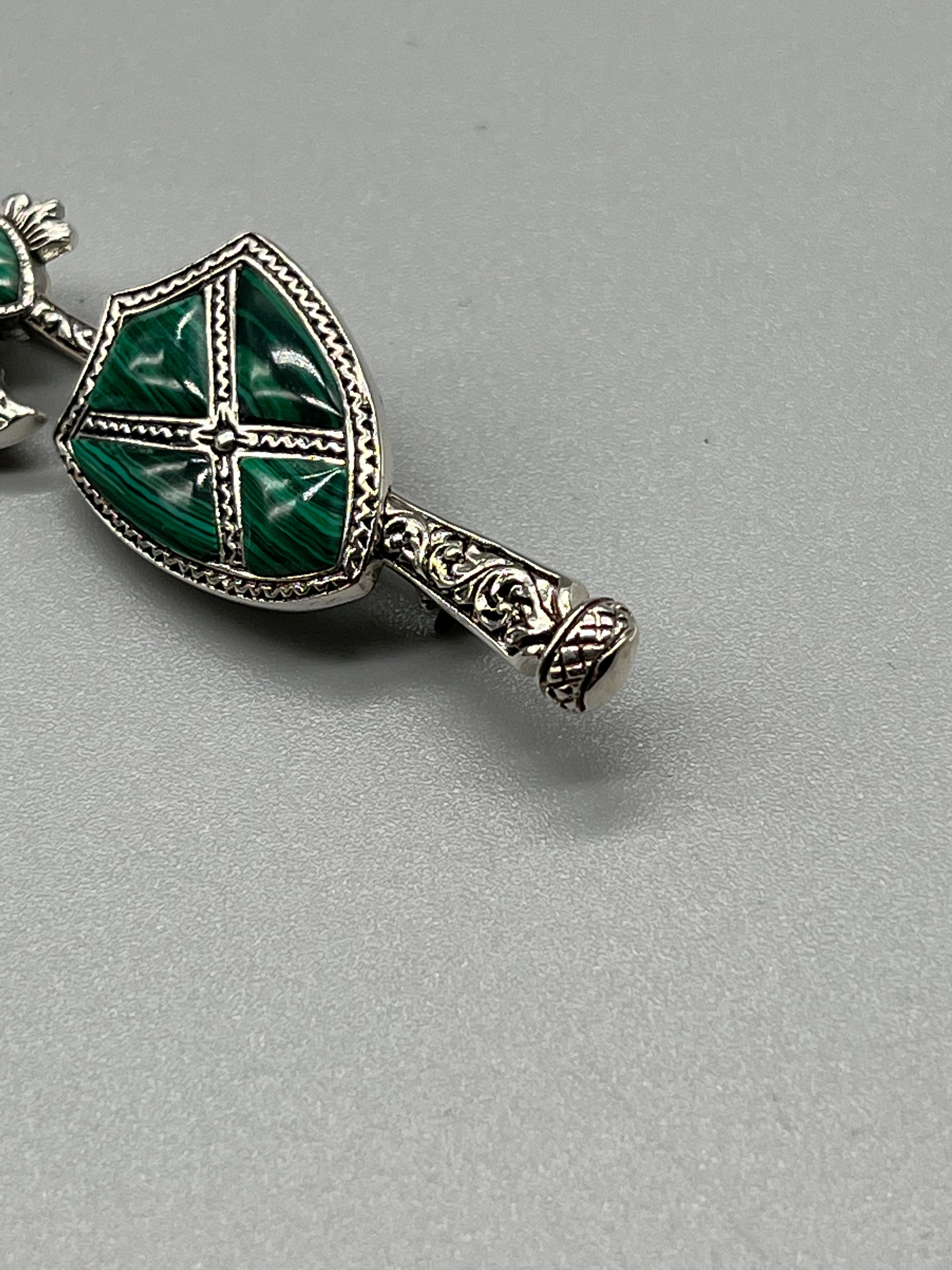 A Silver and Malecite Scottish axe brooch. [5.5cm high] - Image 2 of 3