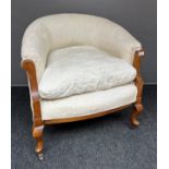 A 19th century bedroom tub chair with cushion seat area.