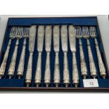 A Victorian silver plated fork and knife set.