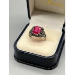 A Ladies Silver Art Deco Ring set with a cushion cut pink stone. [Possibly Ruby] [Ring size P] [
