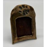 A Miniature bronze frame depicting paw print, Signed D Paterson and dated 2003. [9x6.5cm]