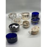 A Collection of various silver hallmarked condiment pots and blue liners. Includes Edinburgh and