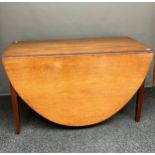 A 19th century mahogany drop end dining table in an oval form. [fully extended- 74x126x183cm]