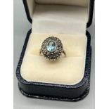 A Ladies 9ct on silver Art Deco ring set with a single aquamarine style stone surrounded by