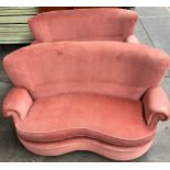 A Pair of vintage kidney shaped sofa. Fitted with a feathered seat cushion. [82x158x98cm]