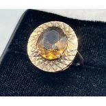 A 9ct gold ring set with a Smokey Quartz stone. [Ring size M] [5.87Grams]