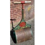 Antique garden roller. Set with a George and dragon panel. [112cm high]