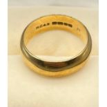 An 18ct gold wedding band. [Ring size Q 1/2] [8.33Grams]