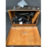 A Vintage Singer Sewing machine '99K' Comes with travel case.