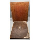 Two antique leather ink blotter folders. One detailed with silver mounts.