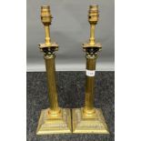 A Pair of gilt brass Corinthian column table lamps. [43cm high]