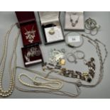 A Quantity of silver jewellery to include necklaces, earrings, bangles, and pearl necklaces.