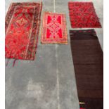 A Lot of four various rugs. To include Persian style runner rug.