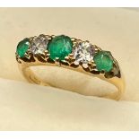 A Yellow Gold ladies Emerald and diamond ring. [Ring size N] [Centre emerald- 5x3.5mm] [Diamonds-