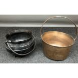 A Vintage brass jelly pan and cast metal cauldron pot with swing handle.