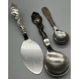 A Lot of three Danish silver handle serving utensils. Two ornate handle utensils produced by Carl