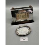 A Birmingham silver front desk Calendar. Together with a Birmingham silver dish. [calendar- 10x14.