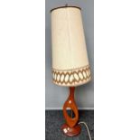 A Mid century teak table lamp.