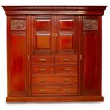 A Victorian Mahogany Compactum Wardrobe late 19th century, The dentil moulded cornice above a