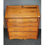 A Lightwood four drawer writing bureau, Interior is fitted with pigeon holes and small drawers. [