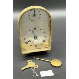 Antique unusual brass cased clock, single drum movement, comes with key and pendulum. [Pendulum
