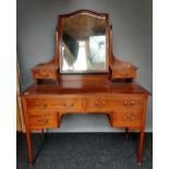 A 19th century knee hole dressing table chest. Fitted with a swivel mirror top and small drawers.