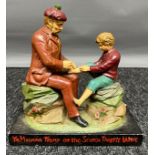 An Antique painted spelter counter shop soap advertising figure from Isdale & McCallum Paisley,