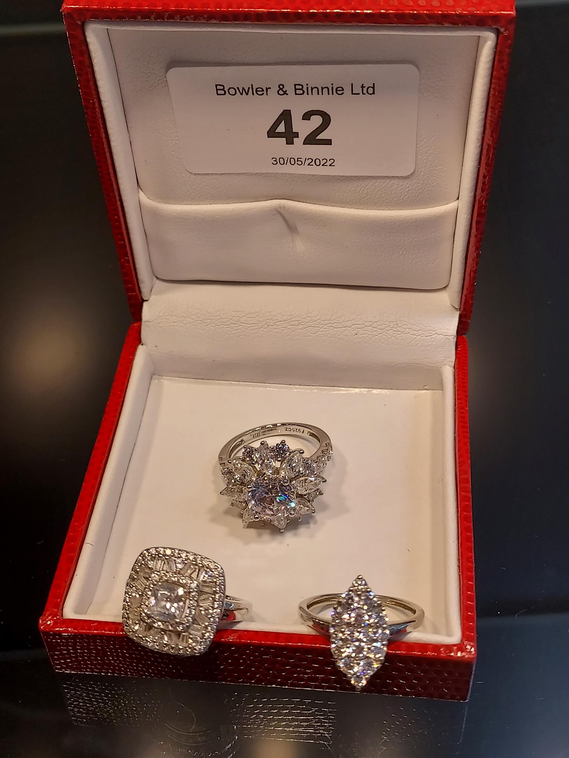 A Lot of three 925 silver ladies rings set with white glass stones. [Ring size I & K]