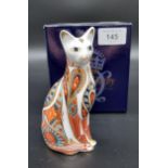 A Royal Crown Derby Siamese cat paperweight, gold button and comes with original box.