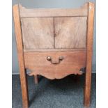 19th cent cabinet, the carved gallery tray above two doors and a carved apron, raised on square legs