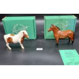 Two Beswick horse figures, titled Dartmoor Warlord and Skewbald Shetland pony. Both come with boxes.