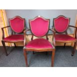 Three 19th century chair's, the cushioned shield back with nail head trim leading to open arm