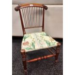 A 19th century nursing chair, reeded back.