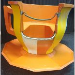 A circa 1970s large fibreglass 'Cup and Saucer' from a juvenile fairground ride.