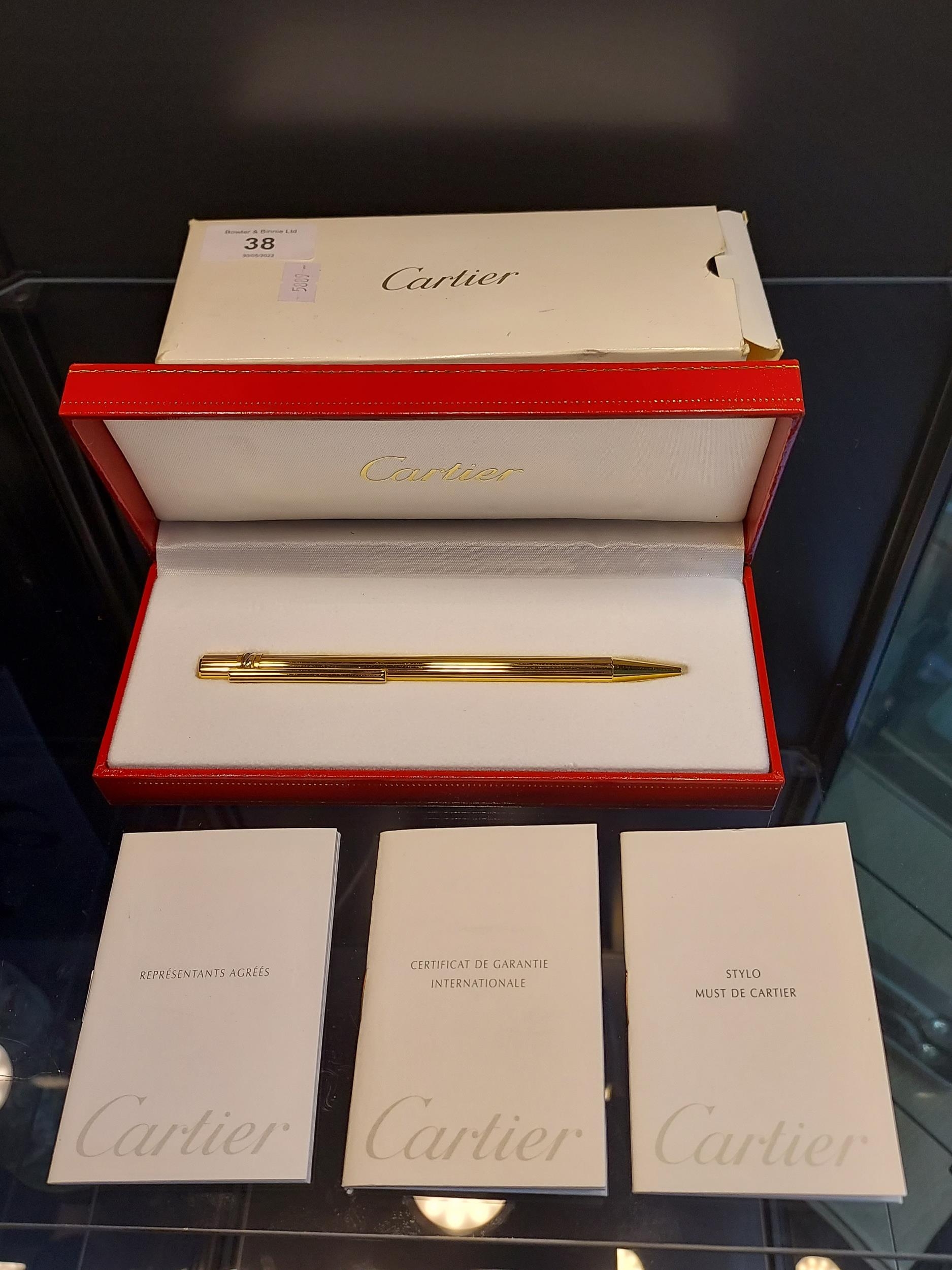 Authentic Cartier St 150030 Stylo Bille Must gold plated ballpoint pen with original box.