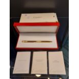 Authentic Cartier St 150030 Stylo Bille Must gold plated ballpoint pen with original box.