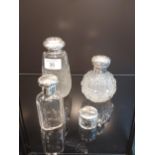 A selection of silver topped items to include Birmingham silver and cut glass sugar shaker,