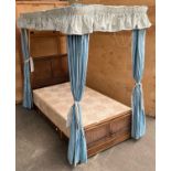 A 19th century 3/4 Mahogany framed, barley twist four poster bed with blue drapes.