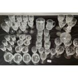 A quantity of cut crystal wine glasses, whisky glasses, facet cut decanter and matching glasses.