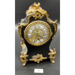 A 19th century mantel clock detailed with brass ormalu mounts, brass and enamel face. [27cm high] [