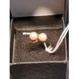 A London 9ct yellow gold and two pearl set ring. [Ring size K] [2.89Grams]