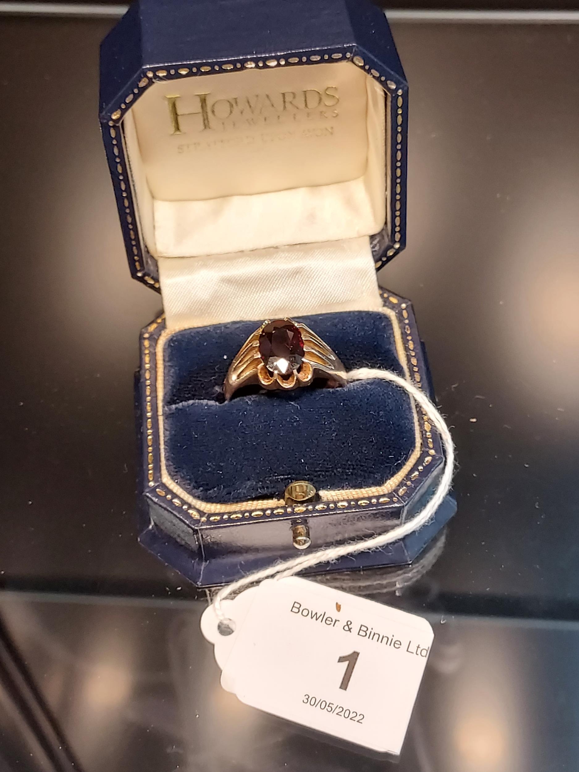 A Gent's Birmingham 9ct yellow gold and single garnet ring. [Ring size T] [6.34grams]