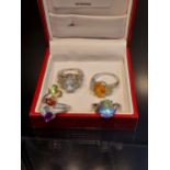 A Lot of four 925 silver rings. Silver 925 ring set with a large orange tourmaline stone off set