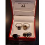A Lot of four 925 silver ladies rings. Two silver 925 rings set with single dark stones [Ring size