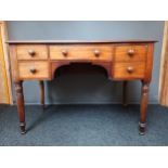 19th century mahogany kneehole writing table, with centre drawer, flanked by two single drawers,