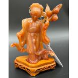 A Chinese Agate geisha figure sculpture sat upon a wooden base. [15cm high]