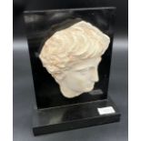 A Black slate and porcelain Greek face sculpture [26x21x8cm]