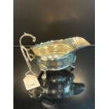 A London silver three foot milk jug. Produced by Edward Barnard & Sons Ltd [93.17grams]