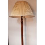 Antique free standing lamp, the carved central column raised on tri outswept legs ending in claw and